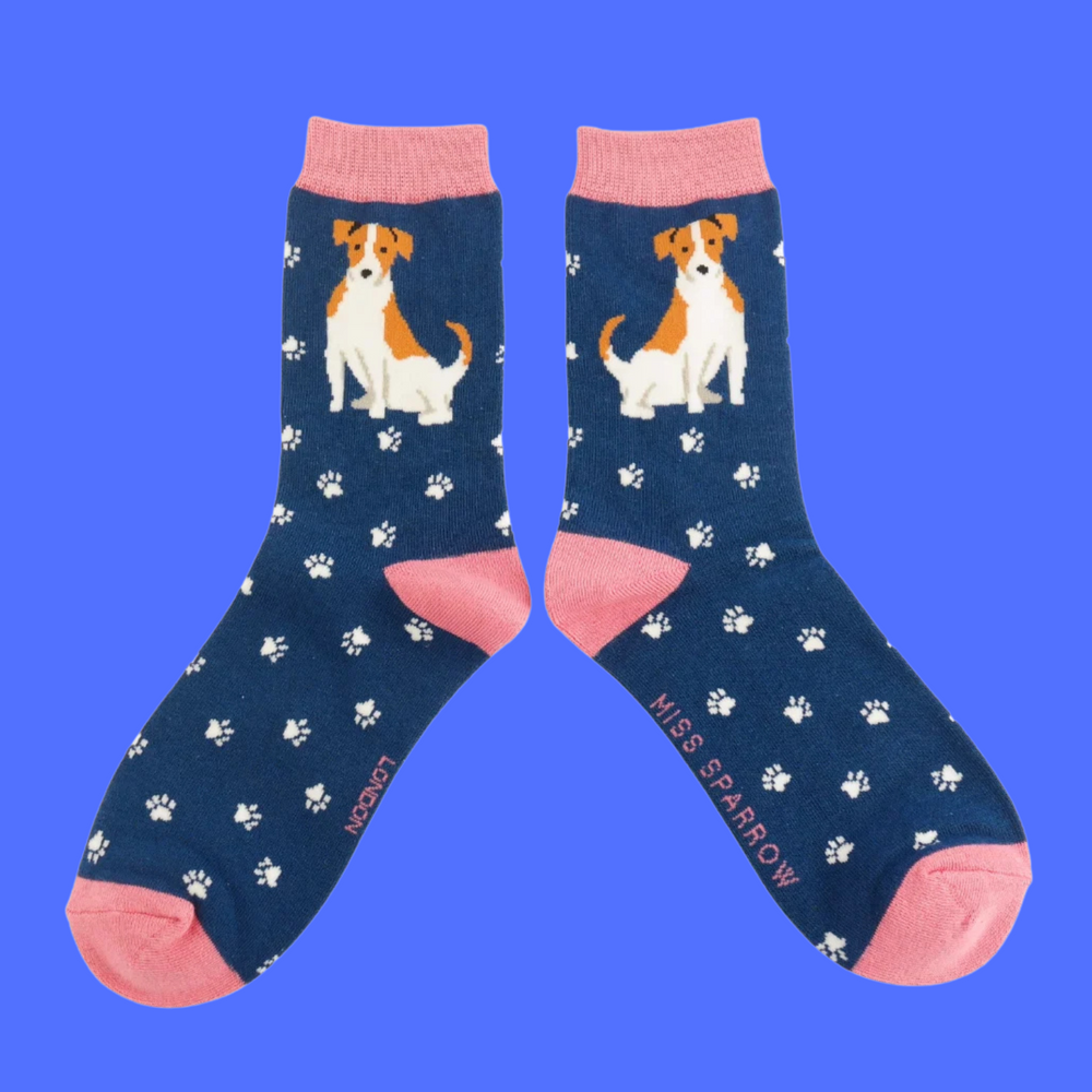 
                      
                        A pair of socks featuring a cute jack russell. Navy legs, pink heel, toe and cuff. 
                      
                    