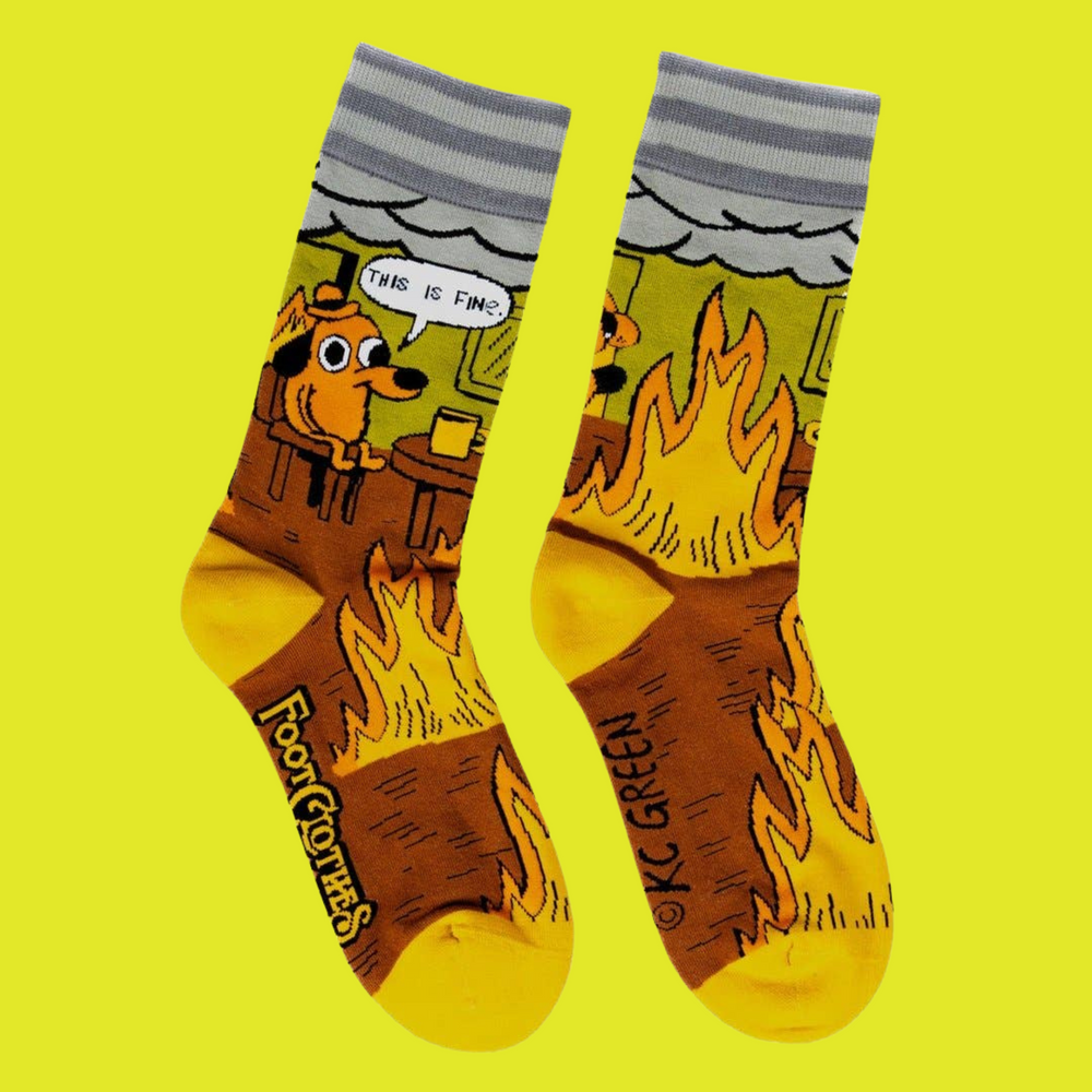 
                      
                        A pair of socks featuring a design by KC Green. Brown flaming legs, yellow heel, toe and cuff. 
                      
                    