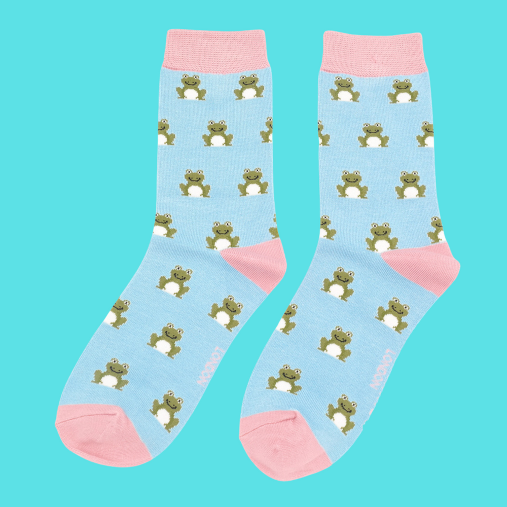 
                  
                    A pair of socks depicting happy frogs. Light blue legs, pink cuff, heels and toes.
                  
                