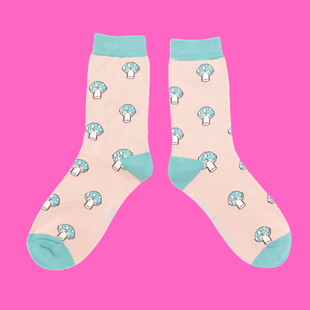 
                      
                        A pair of socks with a mushroom pattern. Peach legs, turquoise cuff, heel and toe.
                      
                    