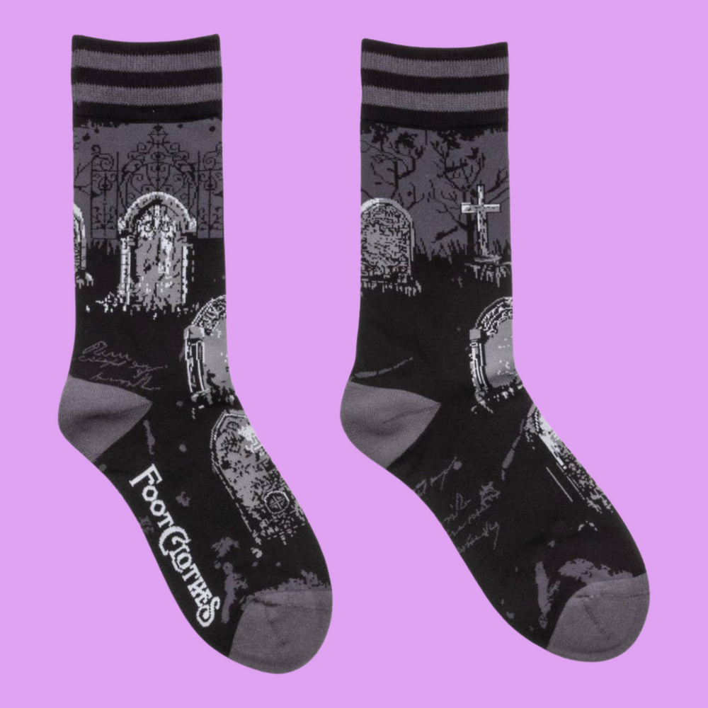 
                      
                        A pair of socks featuring a cemetery motif. Black legs, grey heel, toe and cuff. 
                      
                    