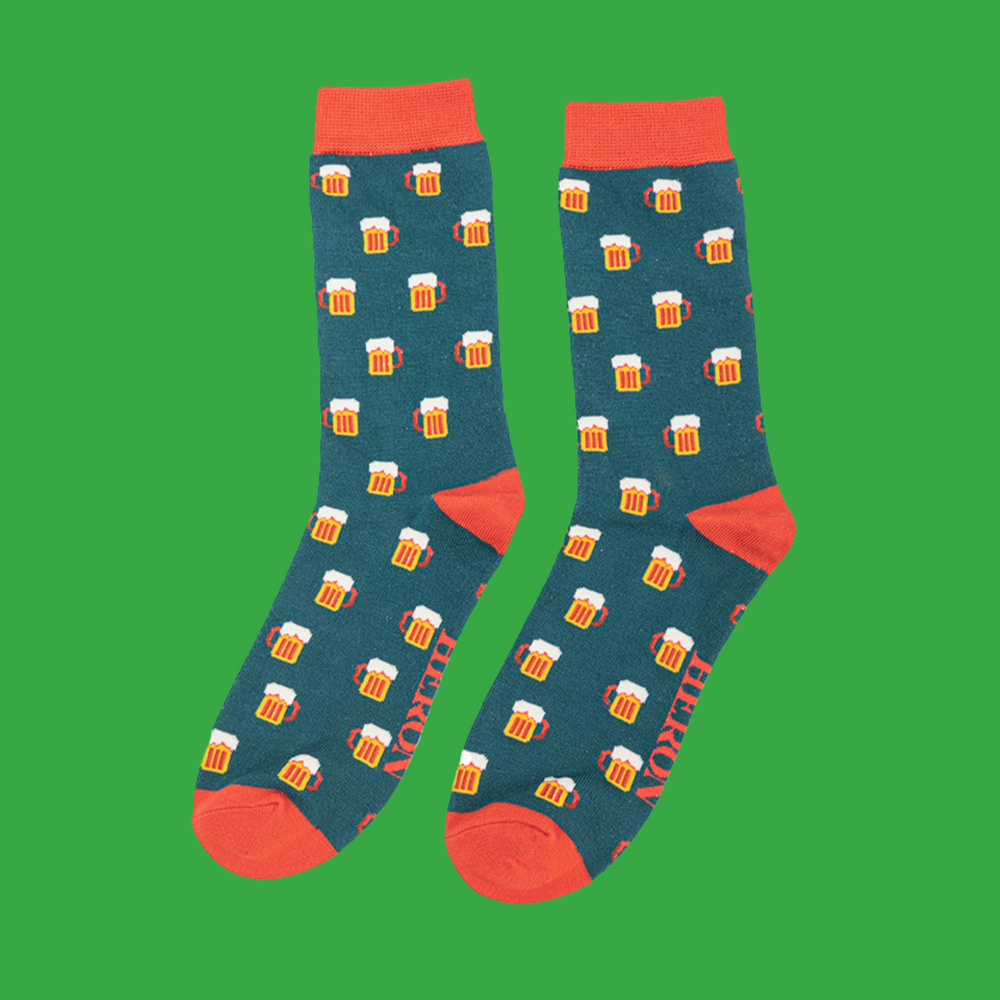 
                  
                    A pair of socks depicting pints of frothing beer. Green legs, orange toe, cuff and heel.
                  
                