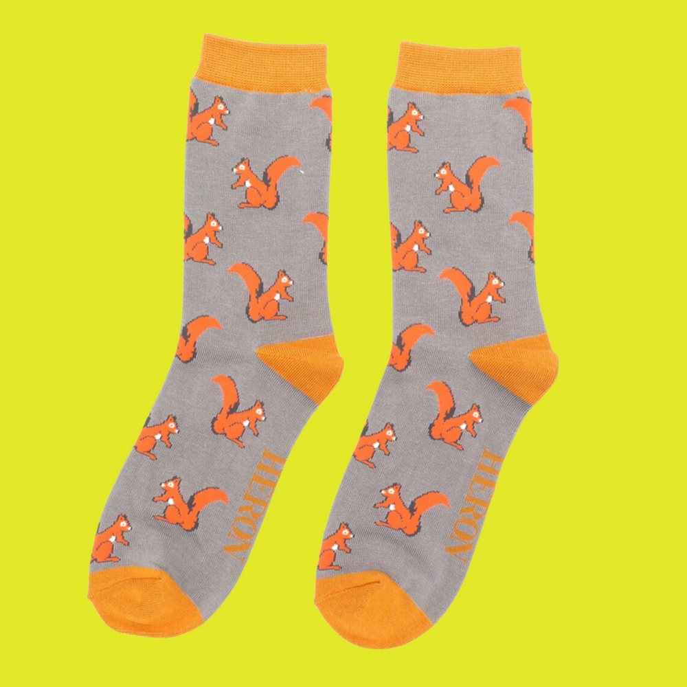 
                  
                    Squirrels Bamboo Socks - Miss Sparrow. A pair of socks with a squirrel motif. Grey legs, yellow cuff, heel and toe. 
                  
                