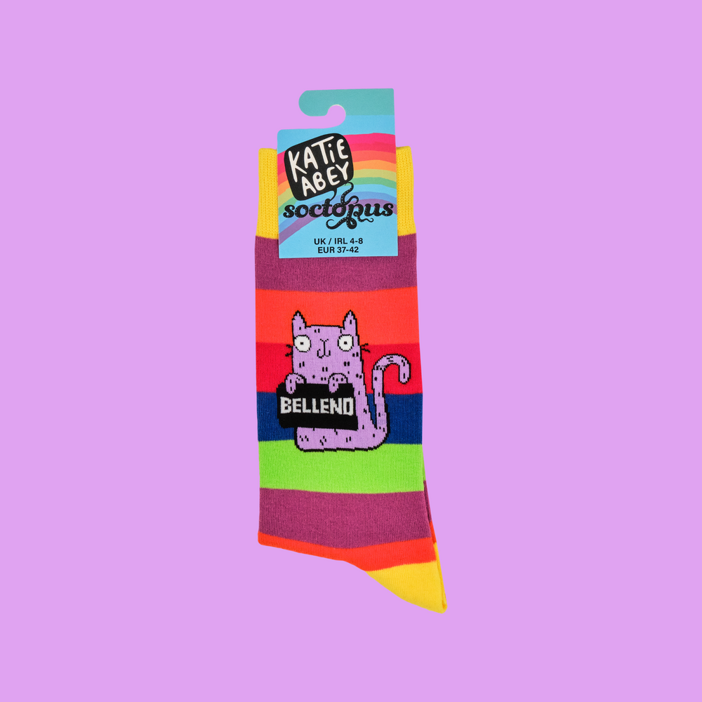 
                      
                        A pair of socks designed by artist Katy Abey,  featuring a cat holding a sign that says Bellend. 
                      
                    