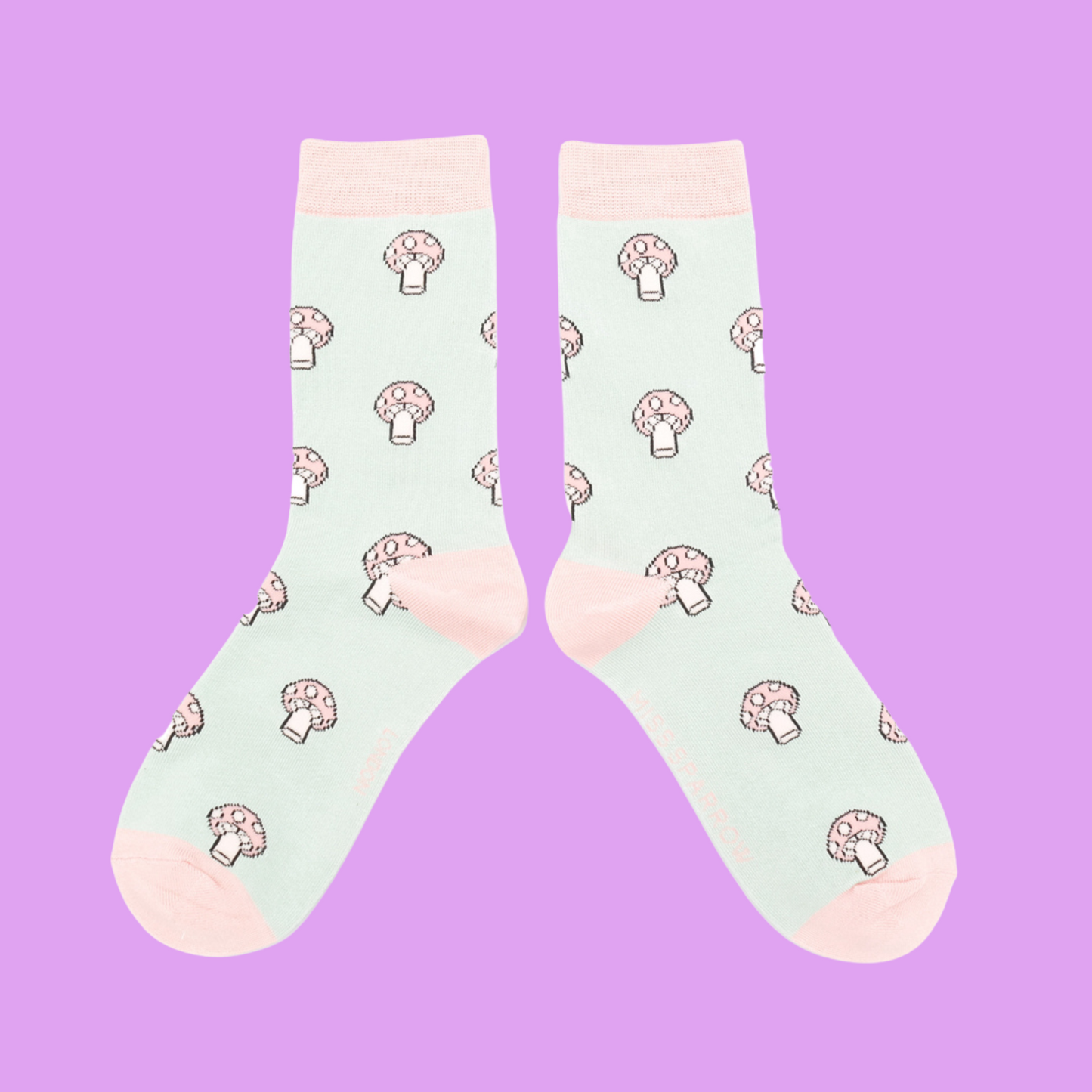 
                  
                    A pair of socks with a mushroom pattern. Light green legs, light pink cuff, heel and toe.
                  
                