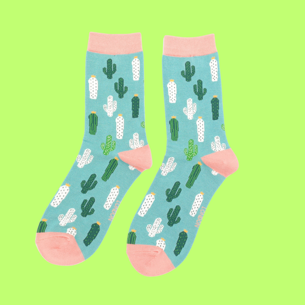 
                  
                    A pair of Socks with a cactus pattern. Teal legs, pink heel, cuff and toe.
                  
                