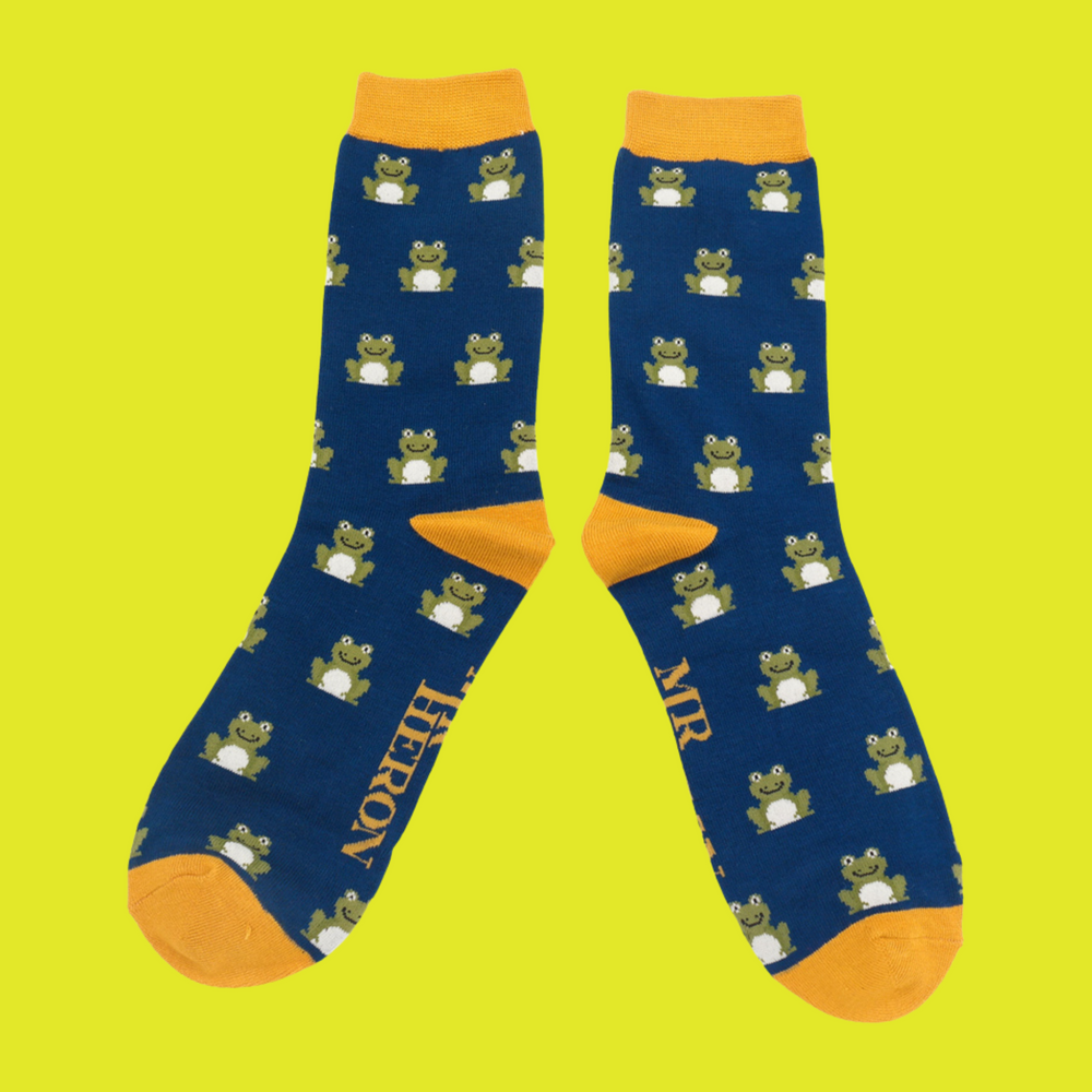 
                  
                    A pair of socks depicting happy frogs. Dark blue legs, yellow cuff, heels and toes.
                  
                