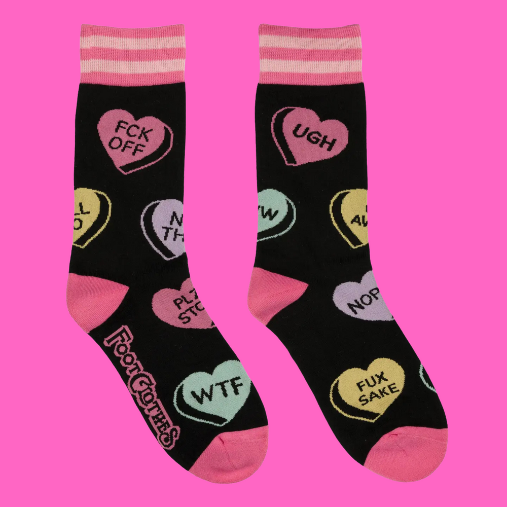 A pair of socks with some sweary love slogans. Black legs, pink heel, toe and cuff. 