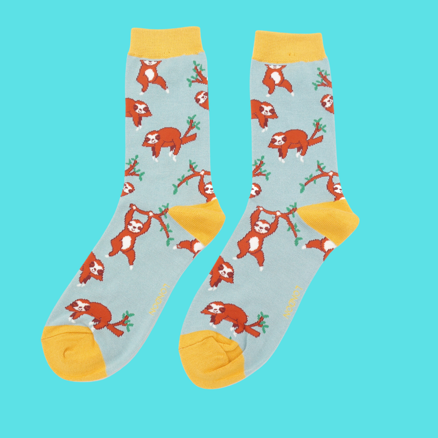 
                  
                    A pair of socks depicting sloths having fun. Light blue legs, yellow cuff, toe and heel.
                  
                