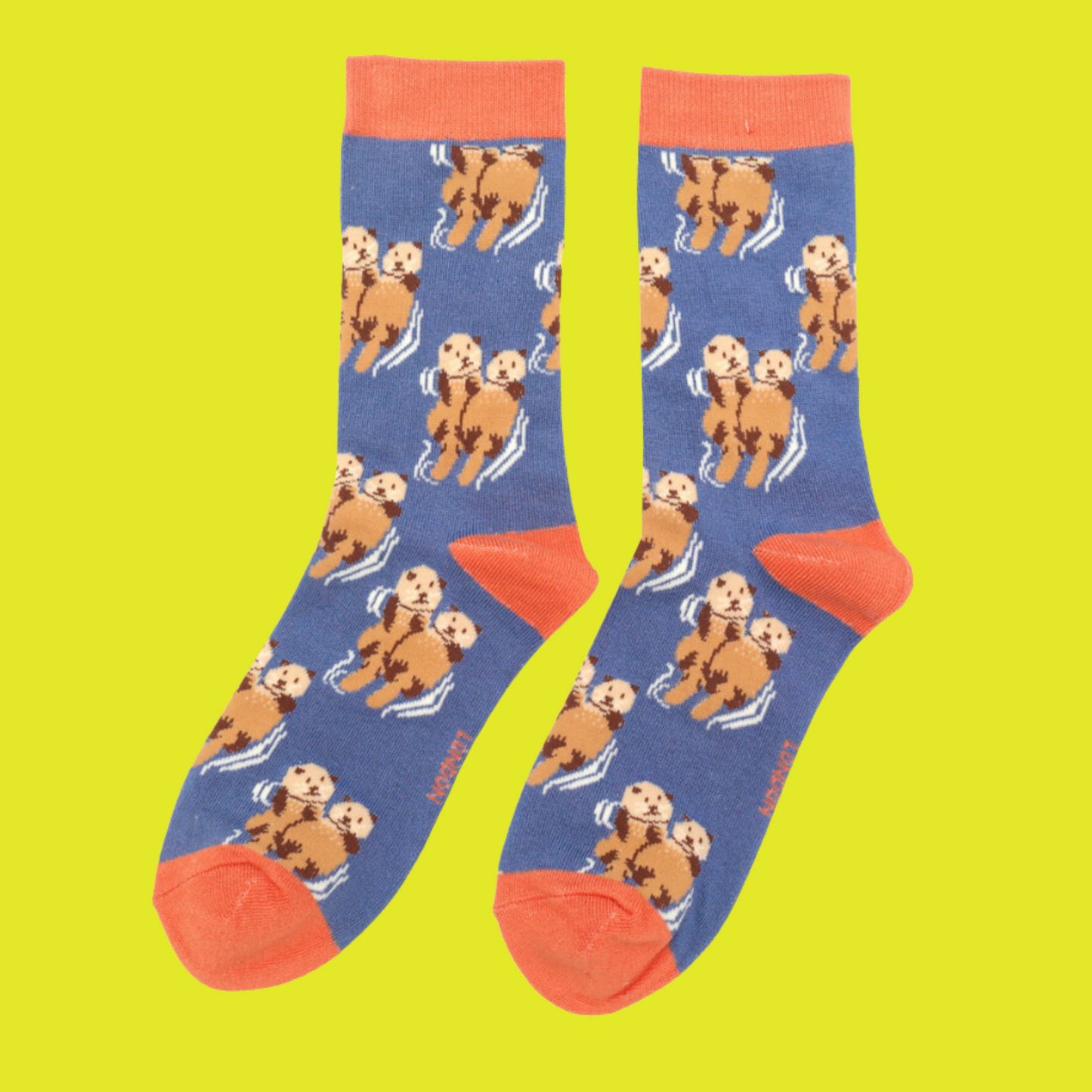 
                  
                    A pair of socks depicting otters holding hands. Blue legs, orange heel, toe and cuff. 
                  
                