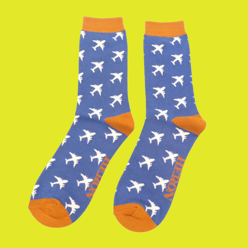 
                  
                    A pair of socks with an airplane motif. Blue legs, orange toes, cuff and heel.
                  
                