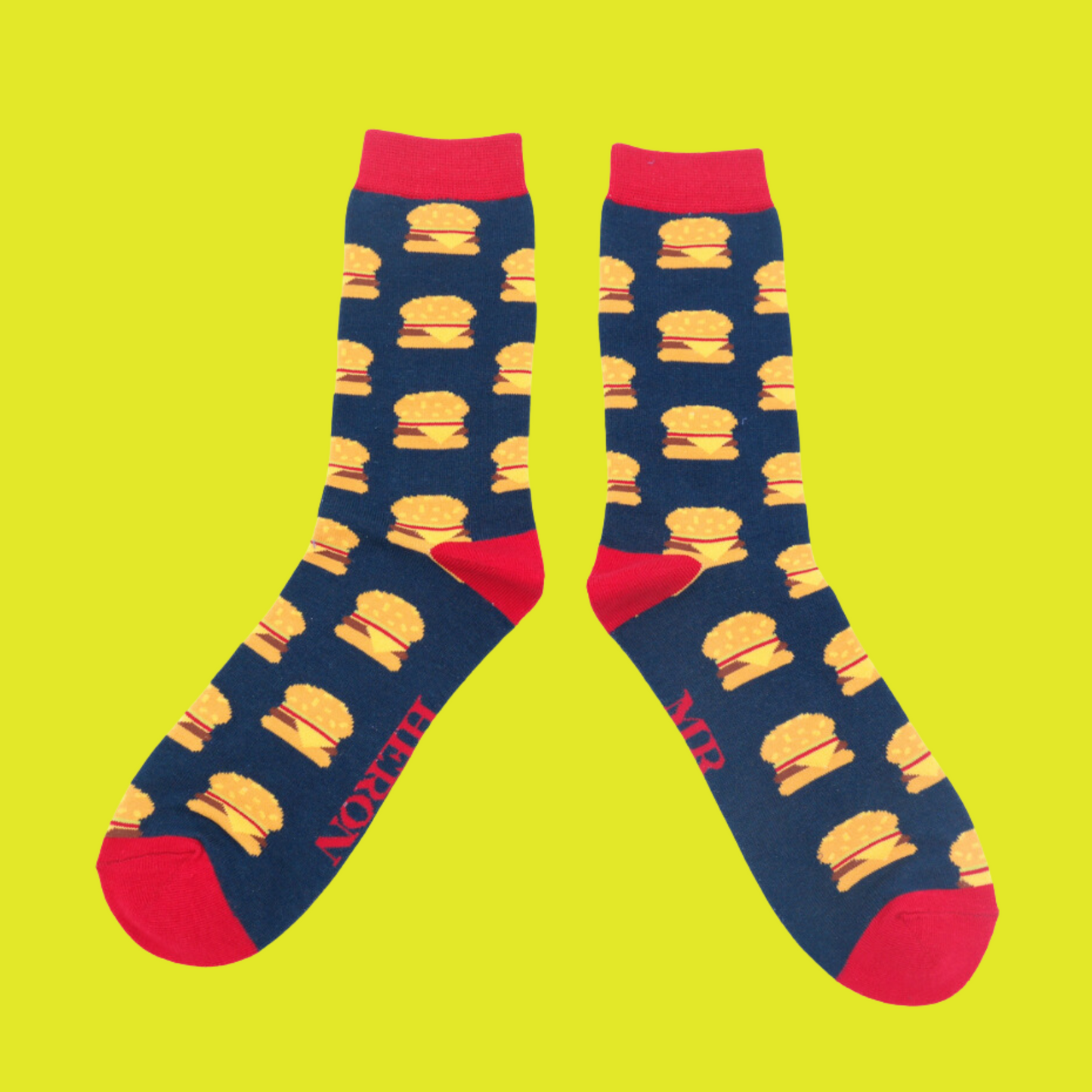 A pair of socks with a juicy burger pattern. Dark Blue legs, red heel, toe and cuff.