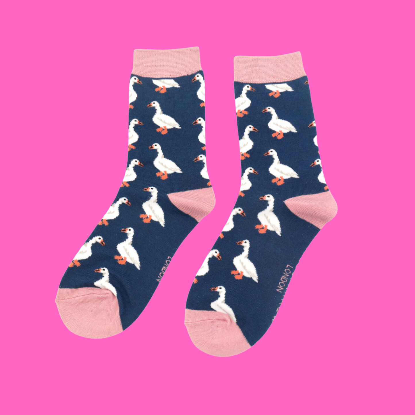 
                  
                    A pair of socks celebrating white ducks. Dark Blue Legs, Pink heel, toe and cuff
                  
                