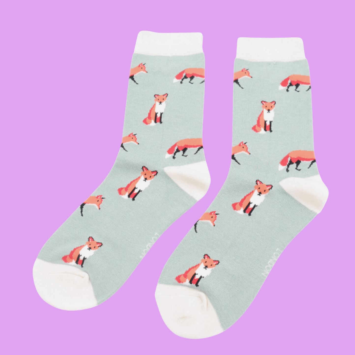 
                  
                    A pair of socks featuring a cute fox design. Light green legs, white cuff, heel and toe.
                  
                