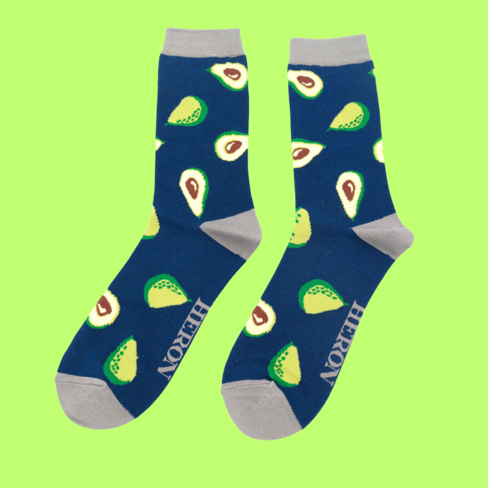 
                  
                    A pair of socks depicting avocados. Dark Blue legs, grey heel, cuff and toe.
                  
                