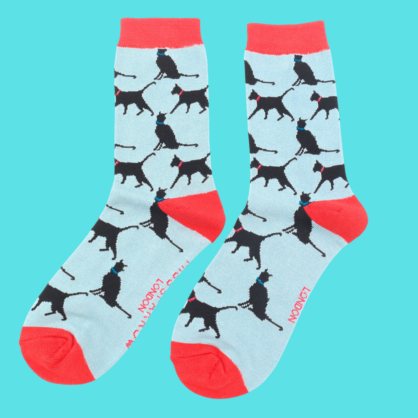 
                  
                    A pair of socks depicting lucky black cats. Light Blue legs, red heel, toe and cuff.
                  
                