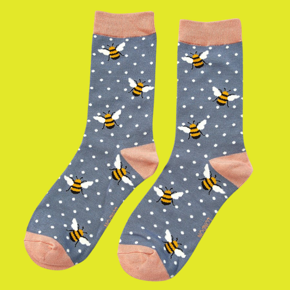 
                  
                    A pair of socks depicting bumble bees. Grey legs, peach cuff, toe and heel.
                  
                