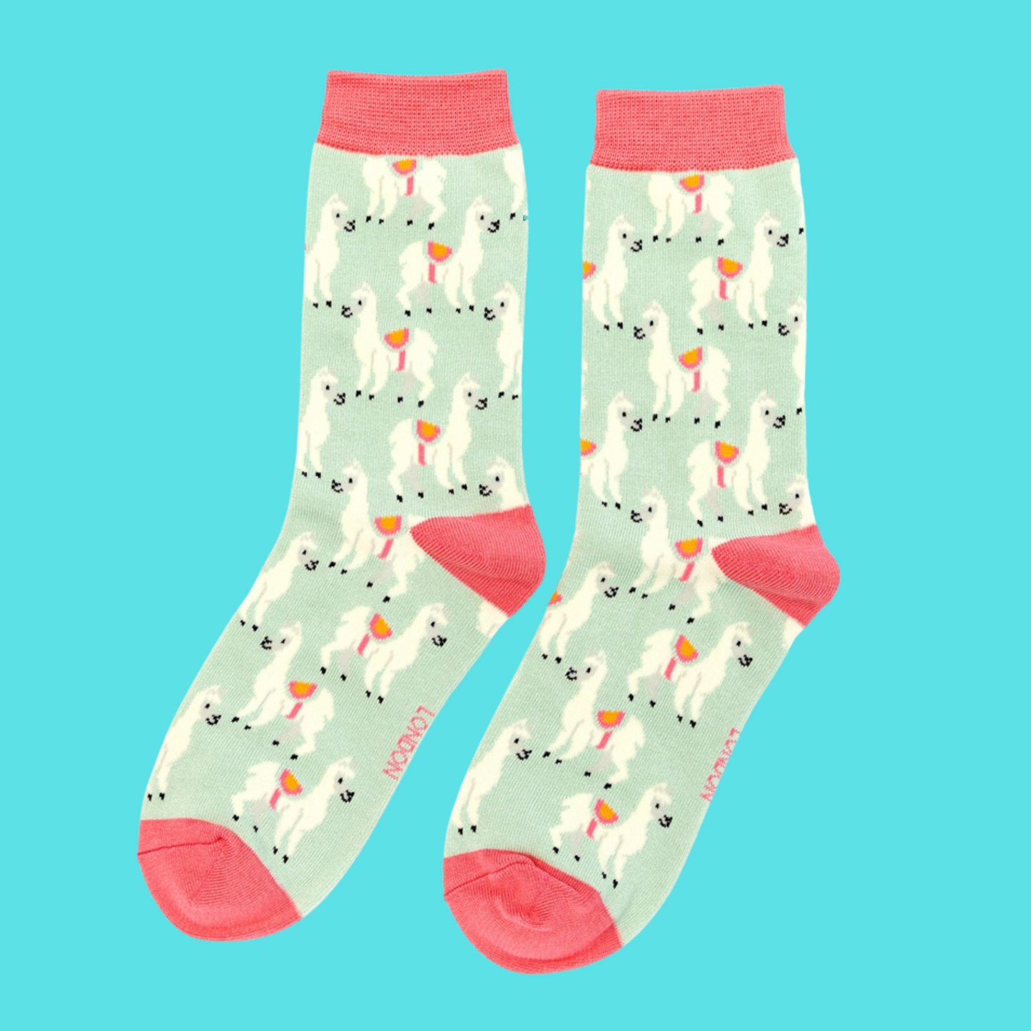 
                  
                    A pair of socks with a fun llama pattern. Light green legs. Pink cuff, heel and toe.
                  
                