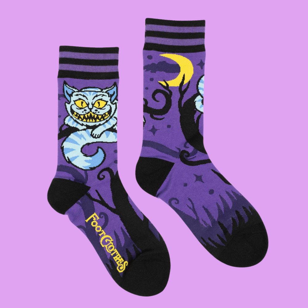 
                      
                        A pair of socks featuring the cheshire cat. Purple legs, black heel, cuff and toe. 
                      
                    