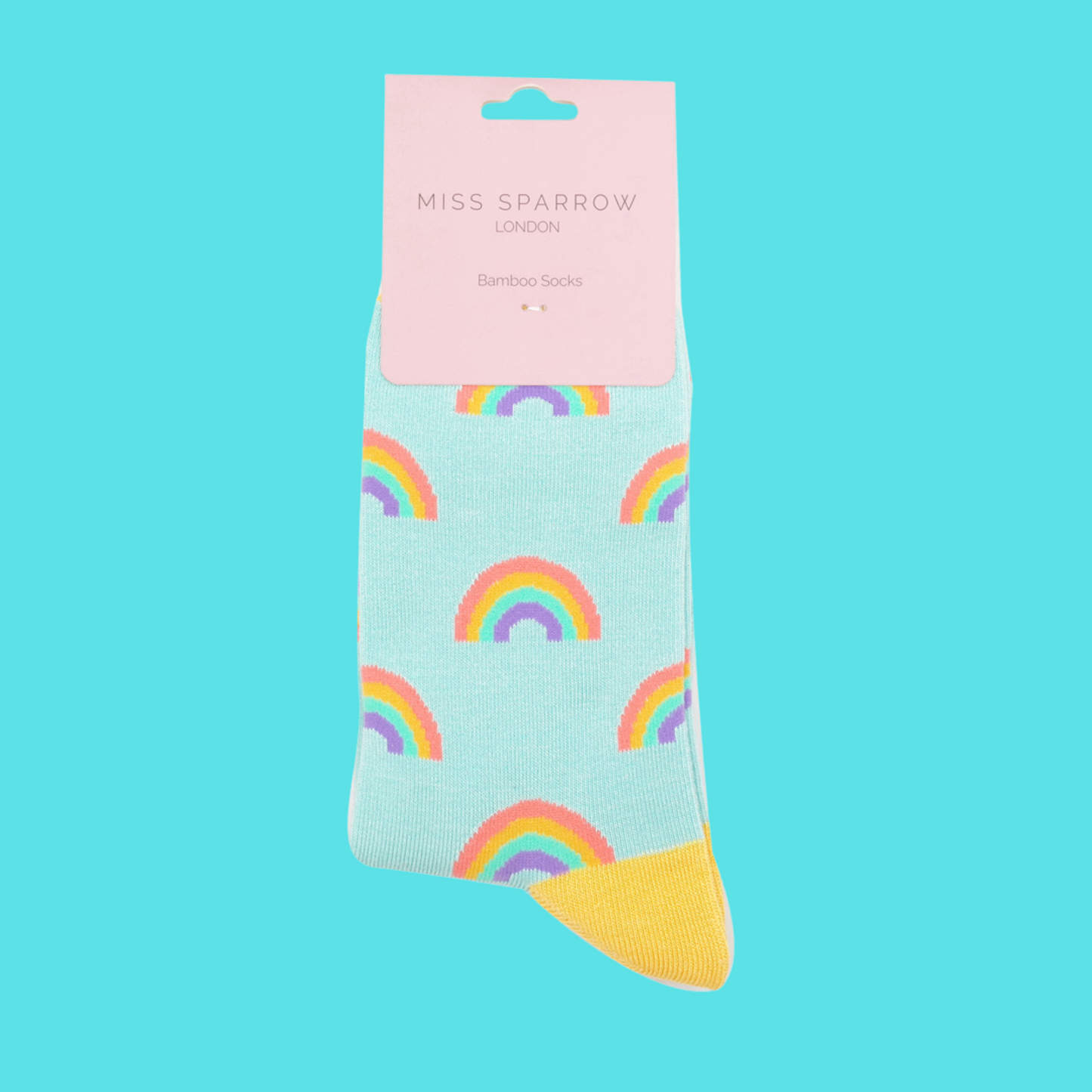 
                  
                    A pair of socks with a rainbow pattern. Light blue legs, yellow cuff, toe and heel.
                  
                