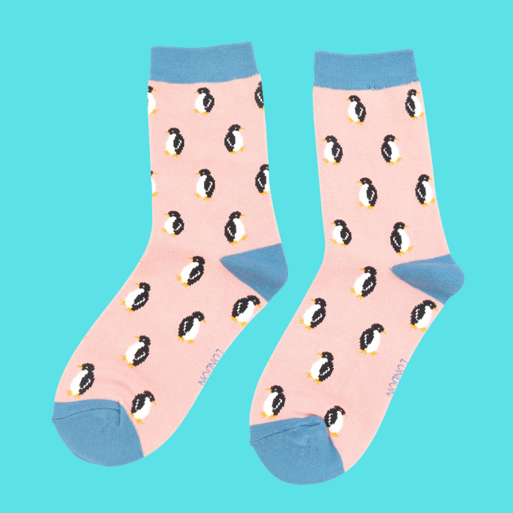 
                  
                    A pair of socks with a penguin pattern. Pink legs, light blue heel, cuff and toe.
                  
                