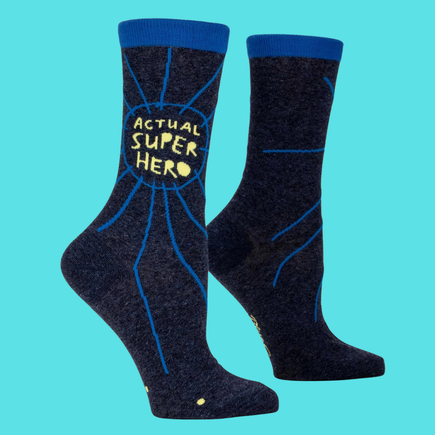 Actual Superhero Socks. A pair of socks with a superhero slogan. Dark blue legs, yellow text. 