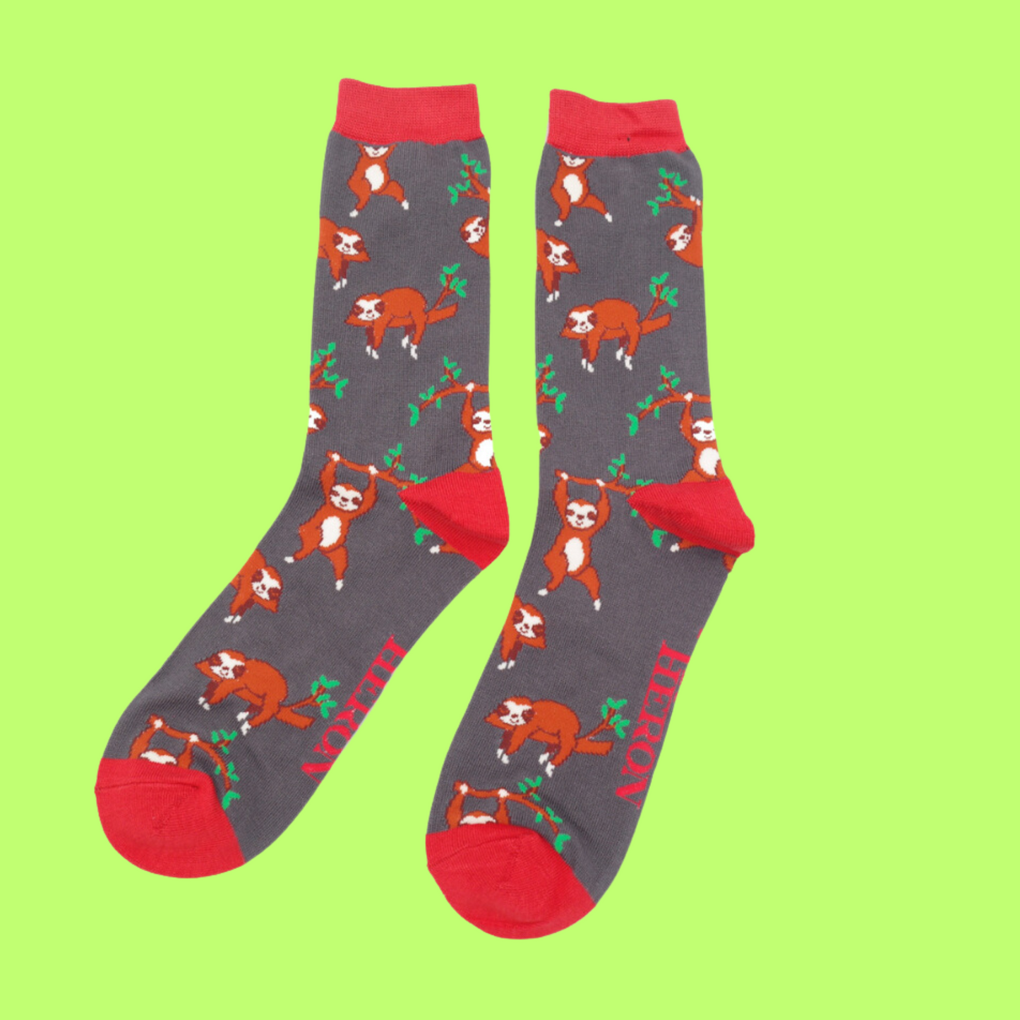 
                  
                    A pair of socks depicting sloths having fun. Grey legs, red cuff, toe and heel.
                  
                