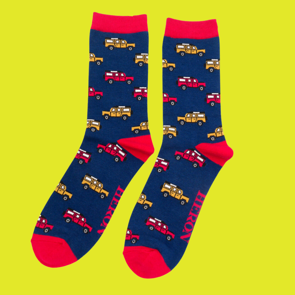 
                  
                    A pair of socks depicting jeeps. Dark blue legs, red cuff, toe and heel.
                  
                