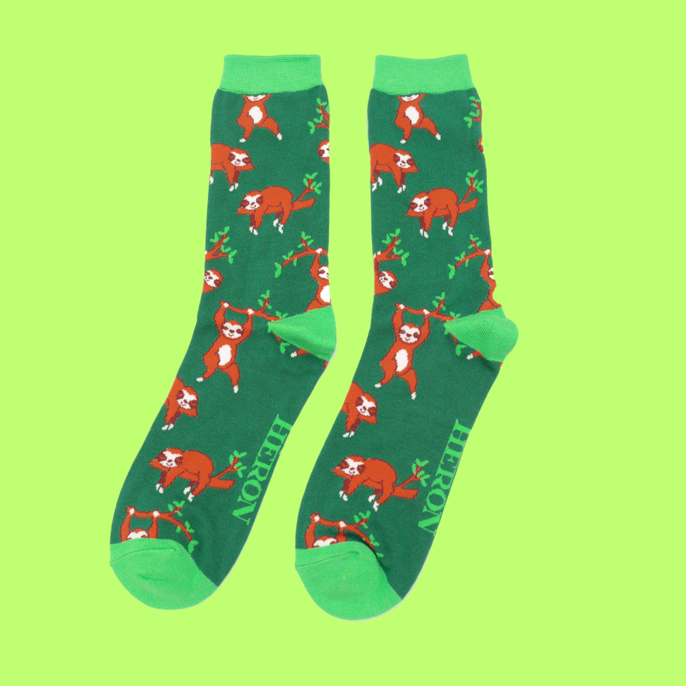 
                  
                    A pair of socks depicting sloths having fun. Green legs, light green cuff, toe and heel.
                  
                