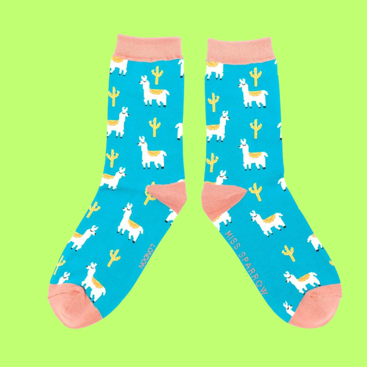 
                  
                    A pair of socks depicting cacti and Llamas. Turquoise legs, peach cuff, heel and toe.
                  
                