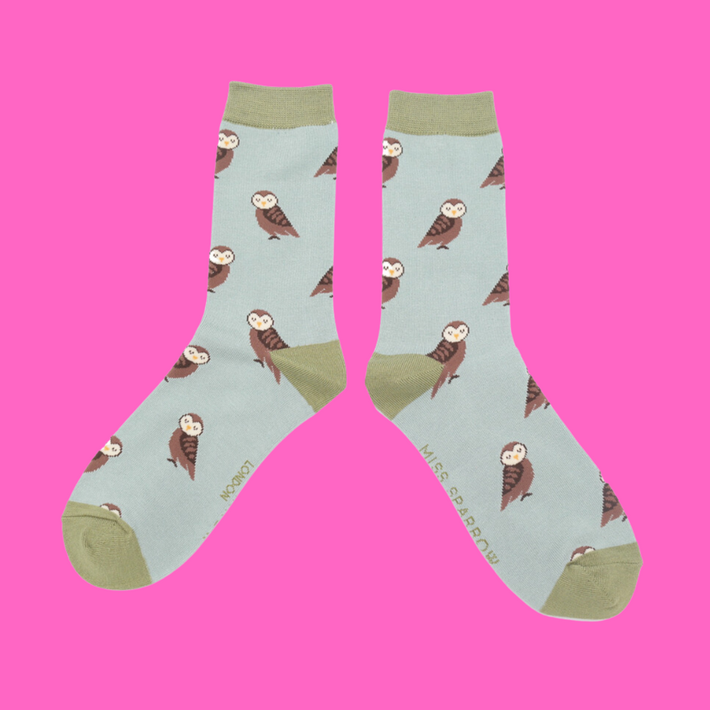 
                  
                    A pair of socks depicting cute owls. Blue legs, green cuff, toe and heel.
                  
                