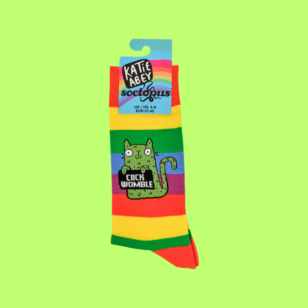 
                      
                        A pair of socks featuring a cute cat holding a sweary sign. Rainbow striped legs. 
                      
                    