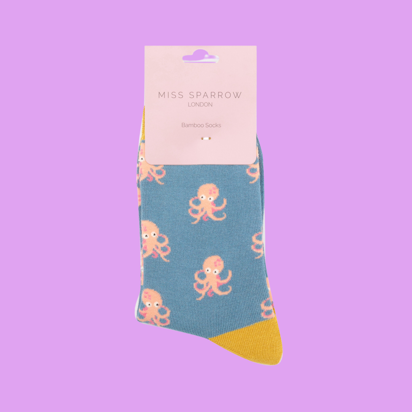 
                  
                    A pair of socks with an octopus pattern. Blue legs, yellow heel, toe and cuff.
                  
                