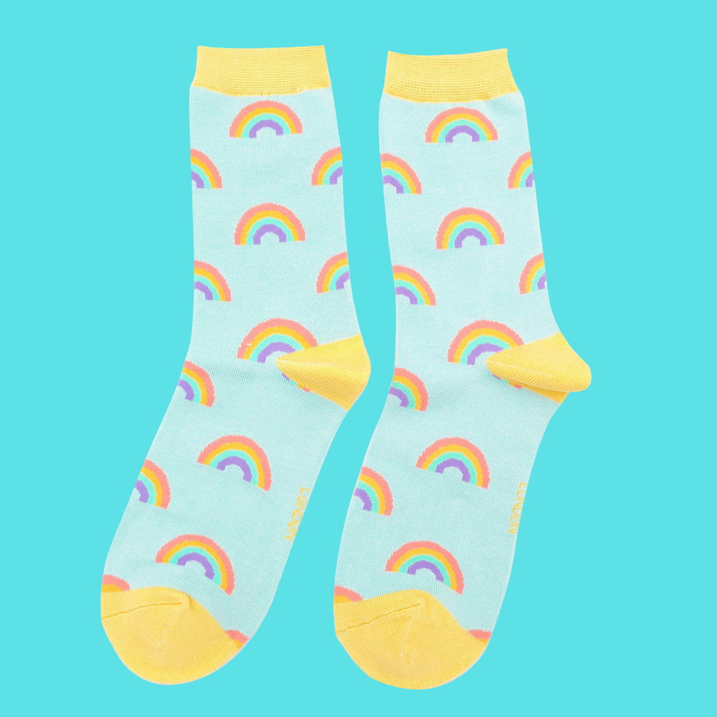 
                  
                    A pair of socks with a rainbow pattern. Light blue legs, yellow cuff, toe and heel.
                  
                