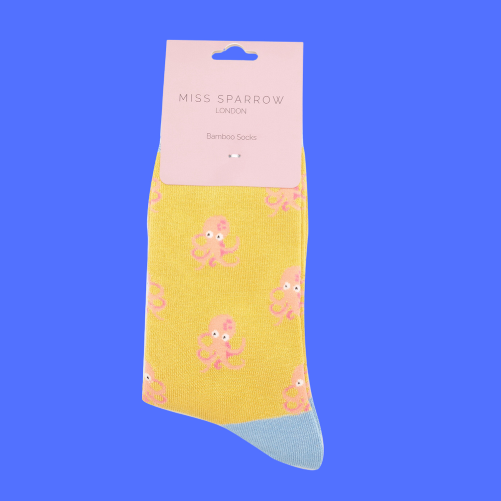 
                  
                    A pair of socks with an octopus pattern. Yellow legs, light blue heel, toe and cuff.
                  
                