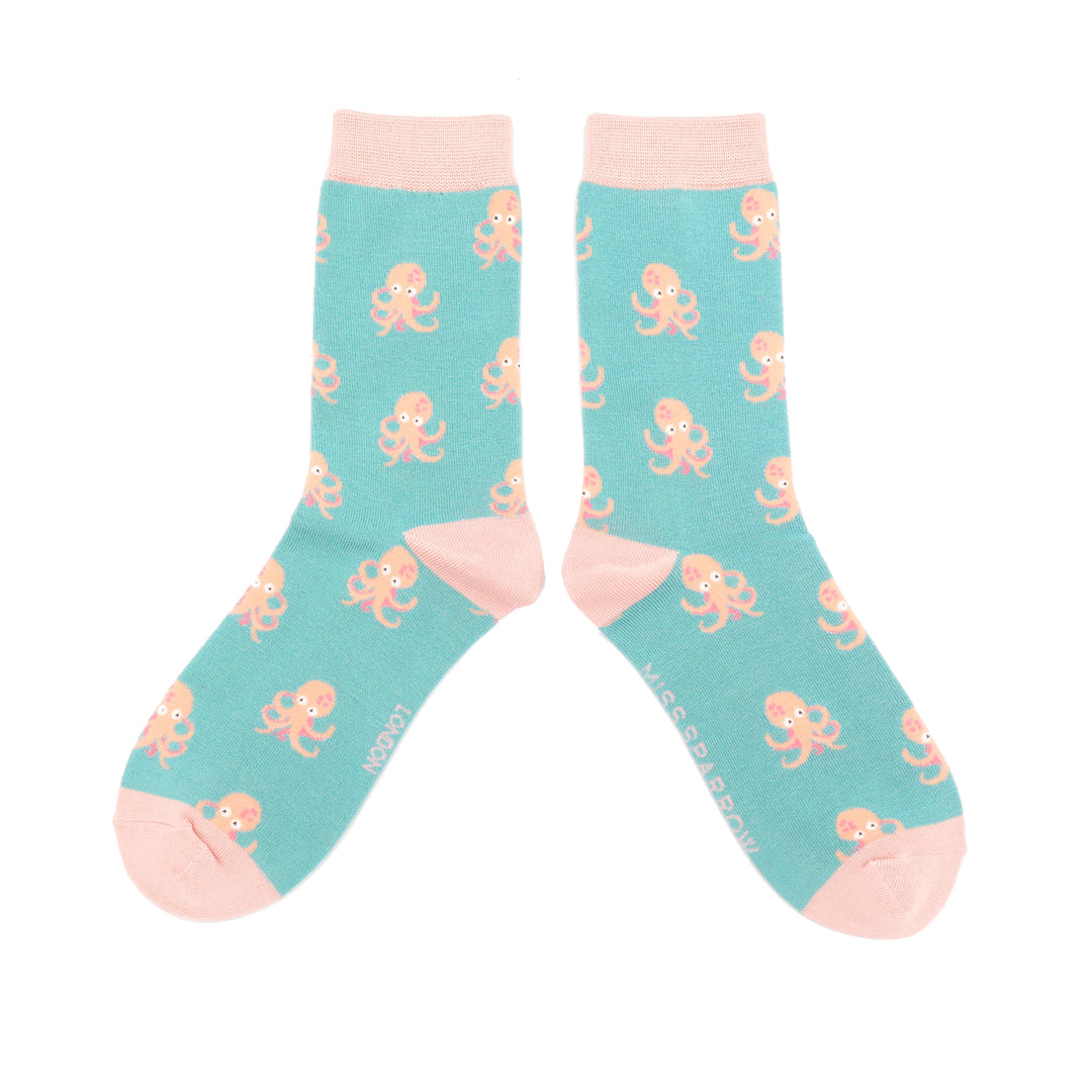 
                  
                    A pair of socks with an octopus pattern. Turquoise legs, pink heel, toe and cuff.
                  
                