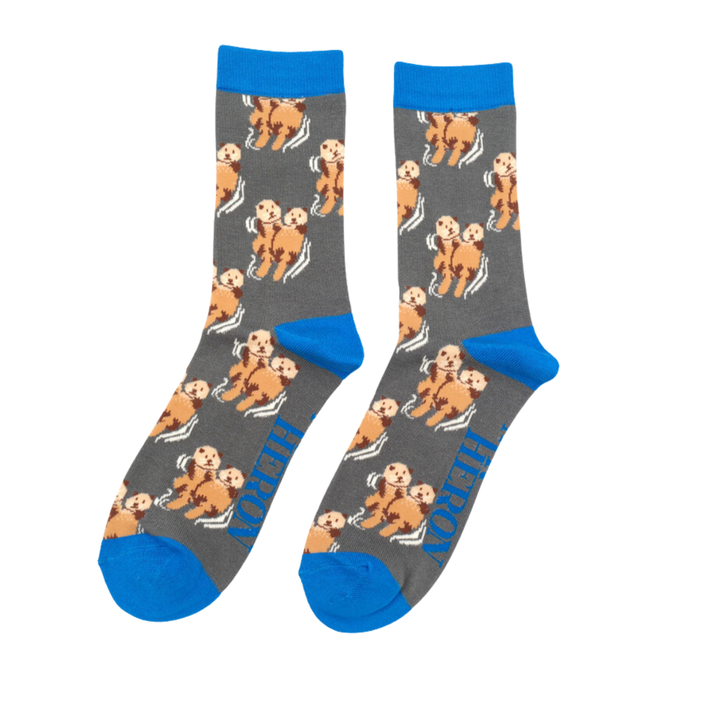 
                  
                    A pair of socks depicting otters holding hands. Grey legs, blue heel, toe and cuff.
                  
                