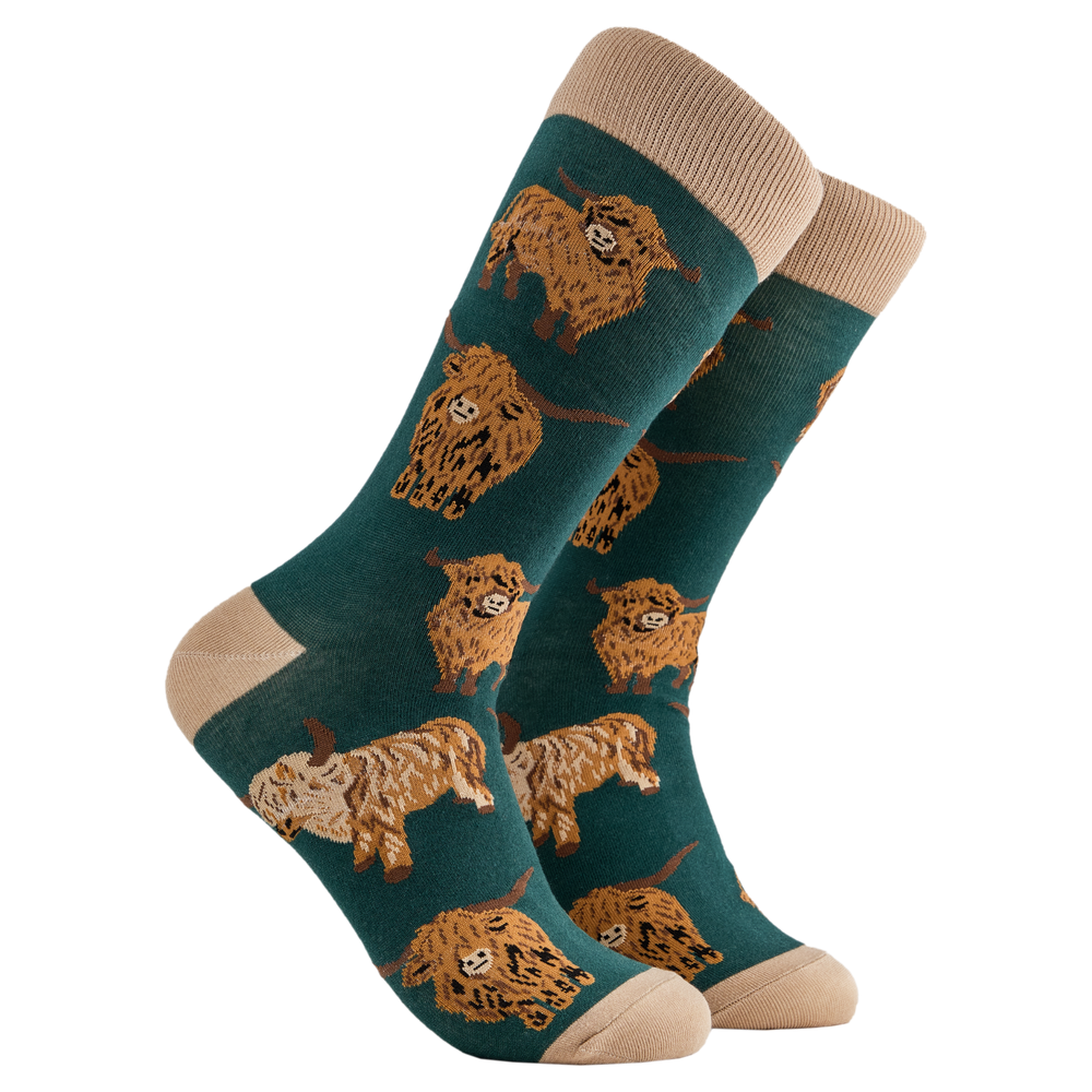 
                      
                        A pair of socks depicting highland cows. Dark green legs, cream cuff, heel and toe.
                      
                    