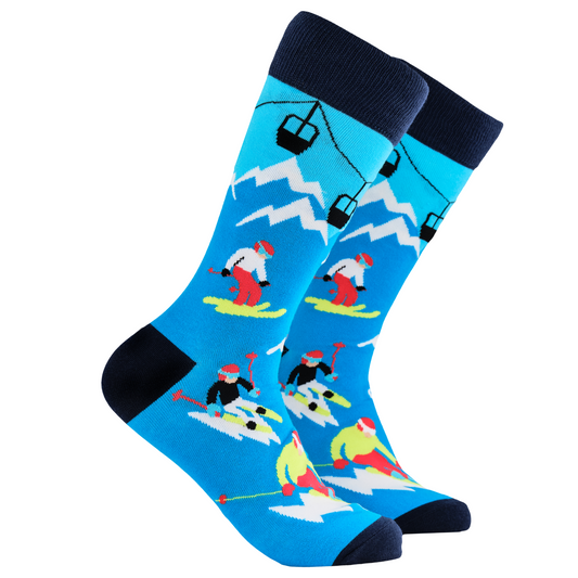 Skiing Socks - Off Piste. A pair of socks depicting skiers on the slopes. Blue legs, dark blue cuff, heel and toe.