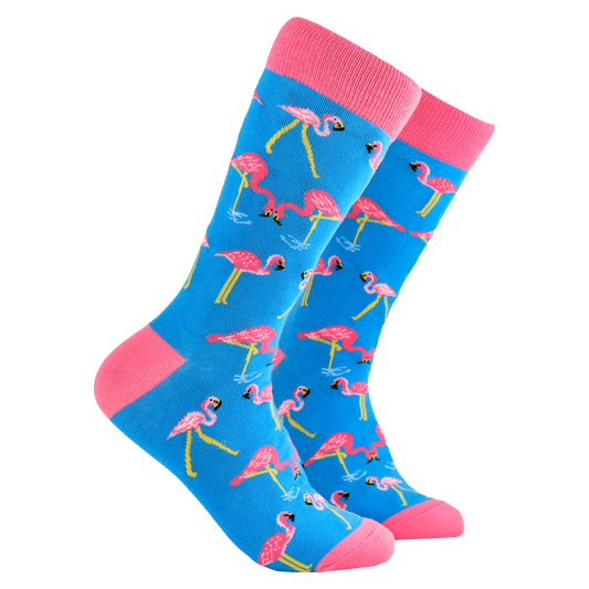 Flamingo Socks - One Legged Wonder. A pair of socks depicting flamingos. Light blue legs, pink cuff, heel and toe.