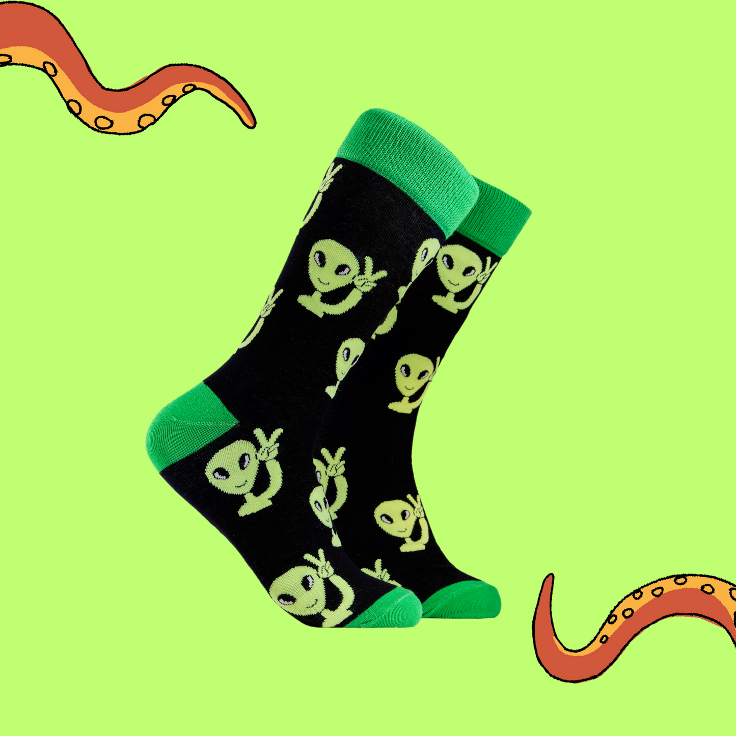 Alien Socks - Peaceman. A pair of socks depicting peaceful aliens. Black legs, green cuff, heel and toe.