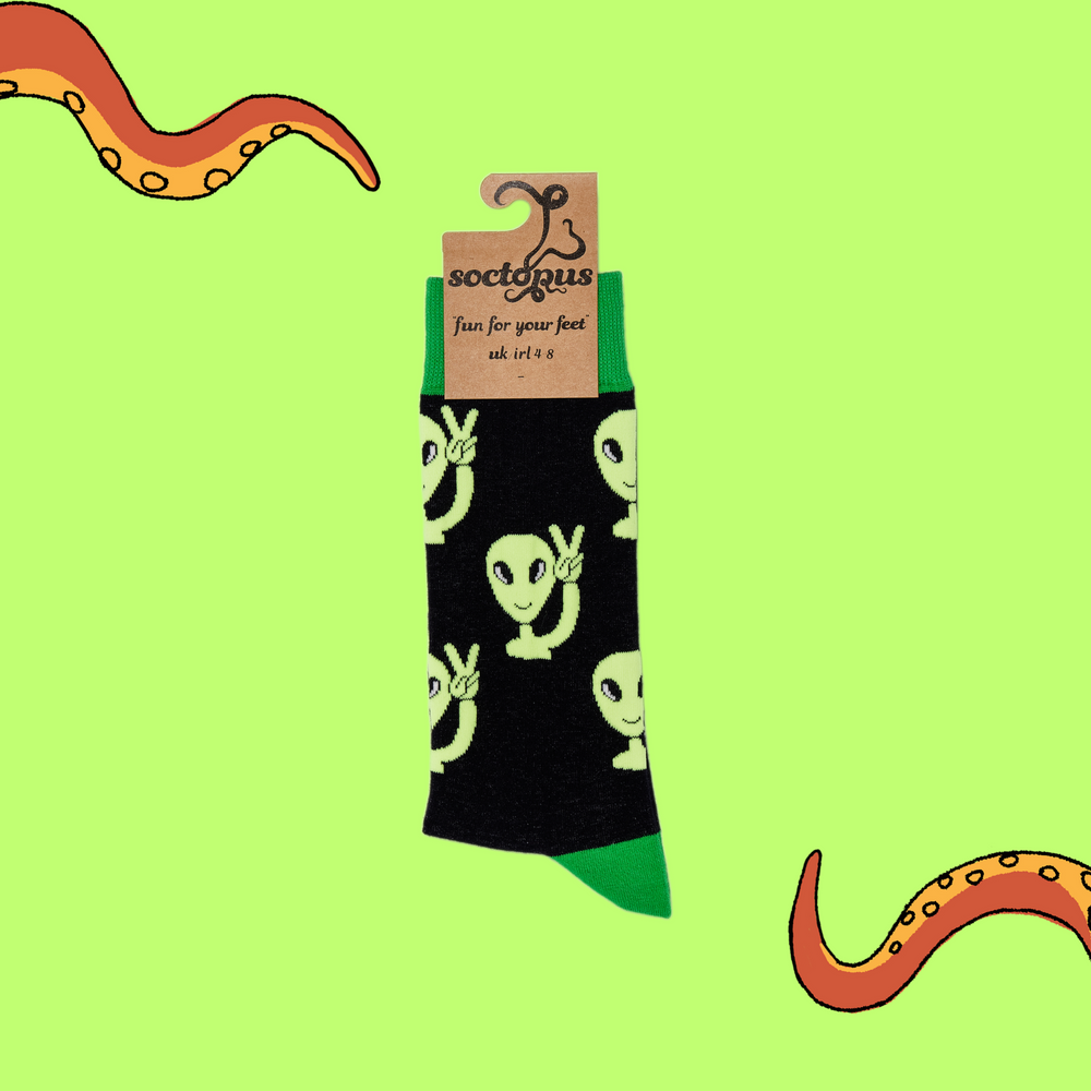 
                      
                        A pair of socks depicting peaceful aliens. Black legs, green cuff, heel and toe. In Soctopus Packaging.
                      
                    