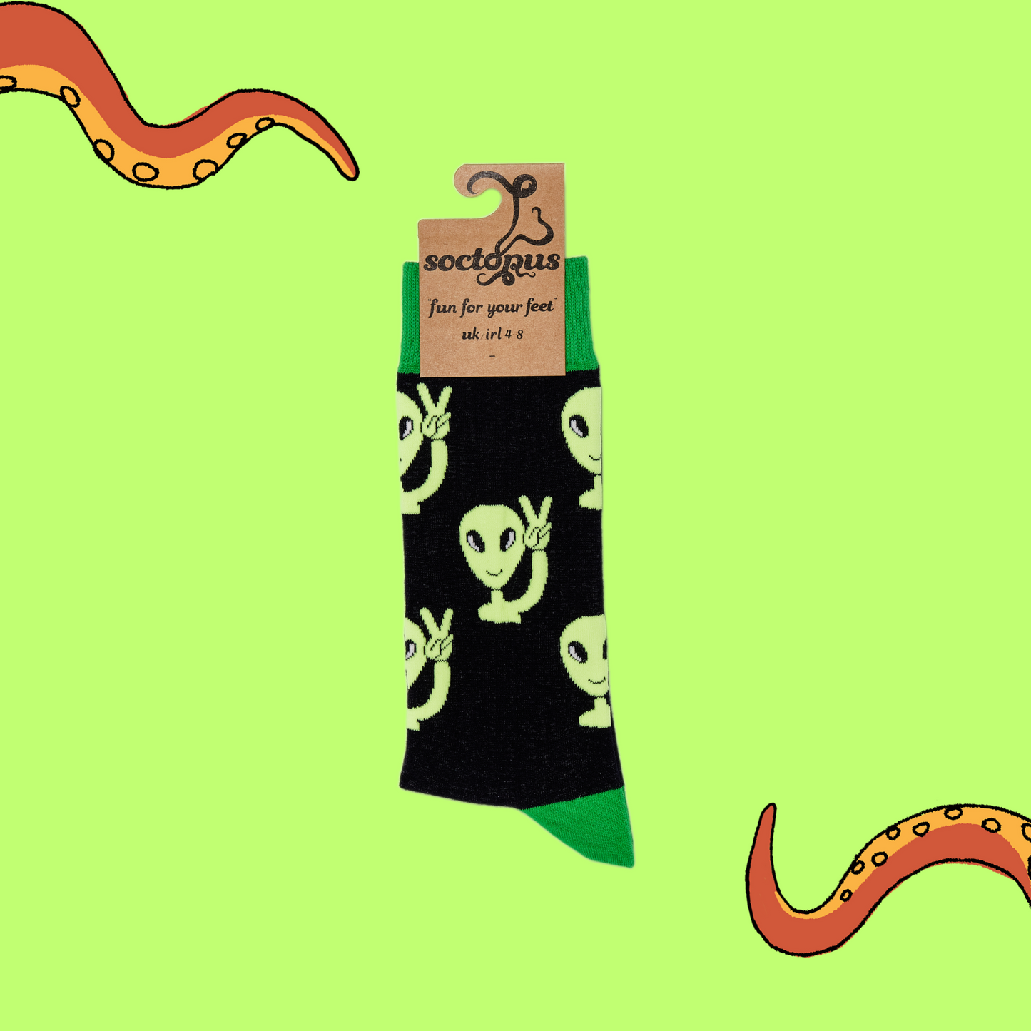 
                  
                    A pair of socks depicting peaceful aliens. Black legs, green cuff, heel and toe. In Soctopus Packaging.
                  
                