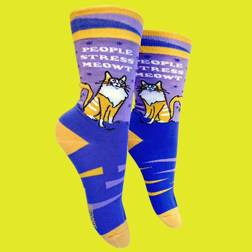 People Stress Meowt Socks. A pair of socks featuring a bold slogan and cat motif with bight blue legs, yellow cuff, heel and tow.