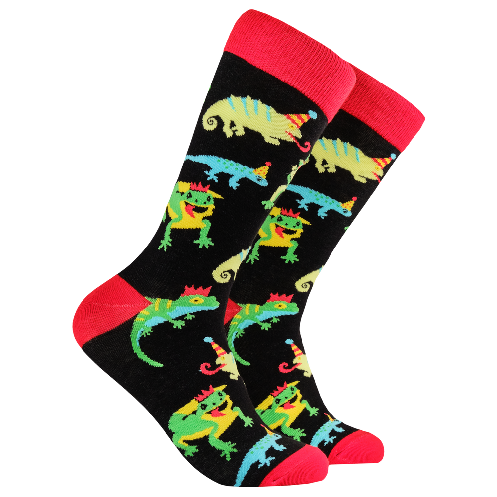 Party Lizard Socks. A pair of socks depicting lizards in party hats. Black legs, red cuffs, heels and toe. 