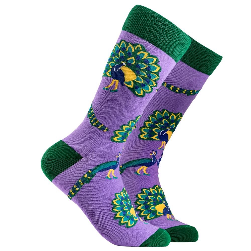 Party Peacocks Socks. A pair of socks depicting peacocks. Purple legs, green cuff, heel and toe.