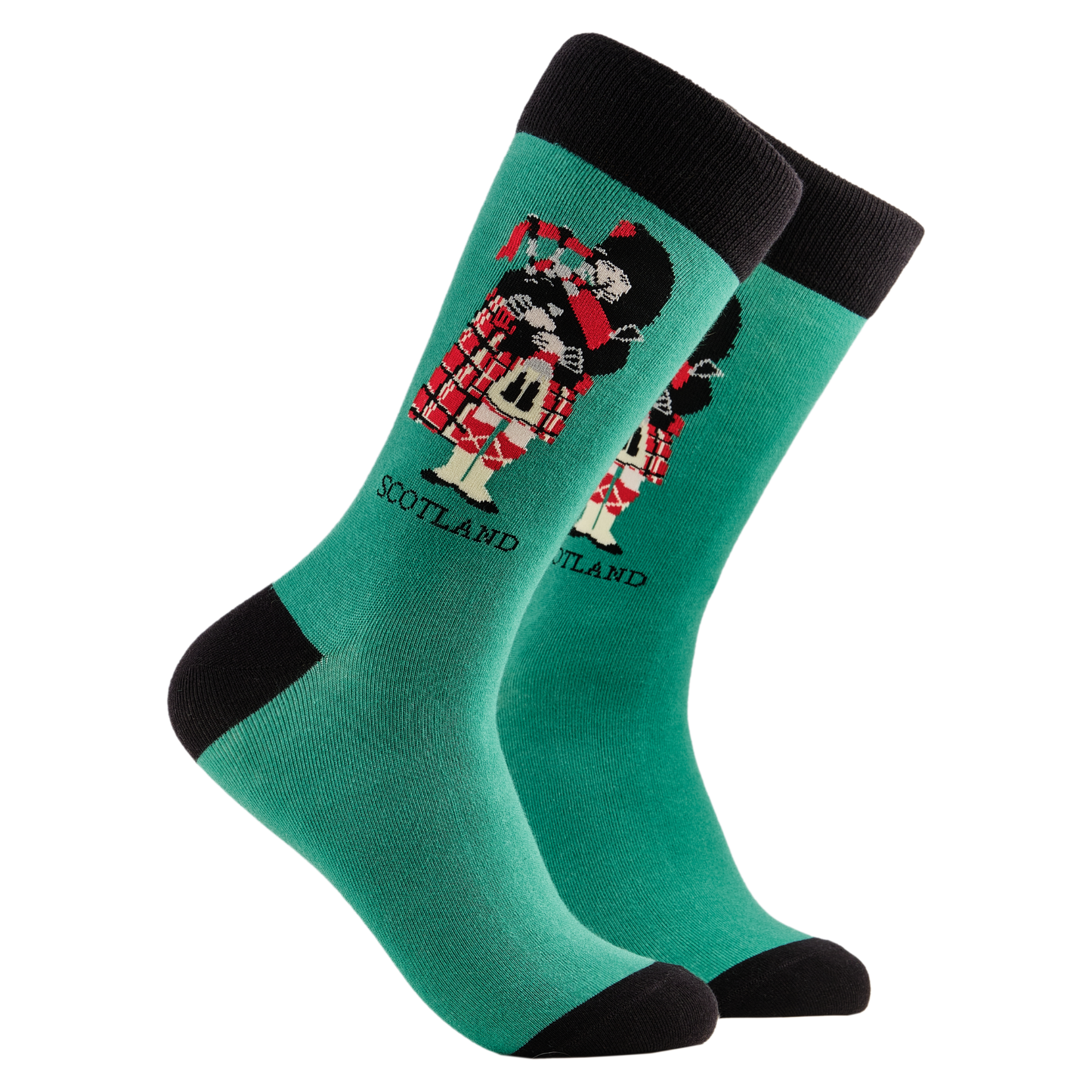 
                  
                    Scottish Socks - Piper. A pair of socks depicting a scotsman playing bag pipes. Green legs, black cuff, heel and toe.
                  
                