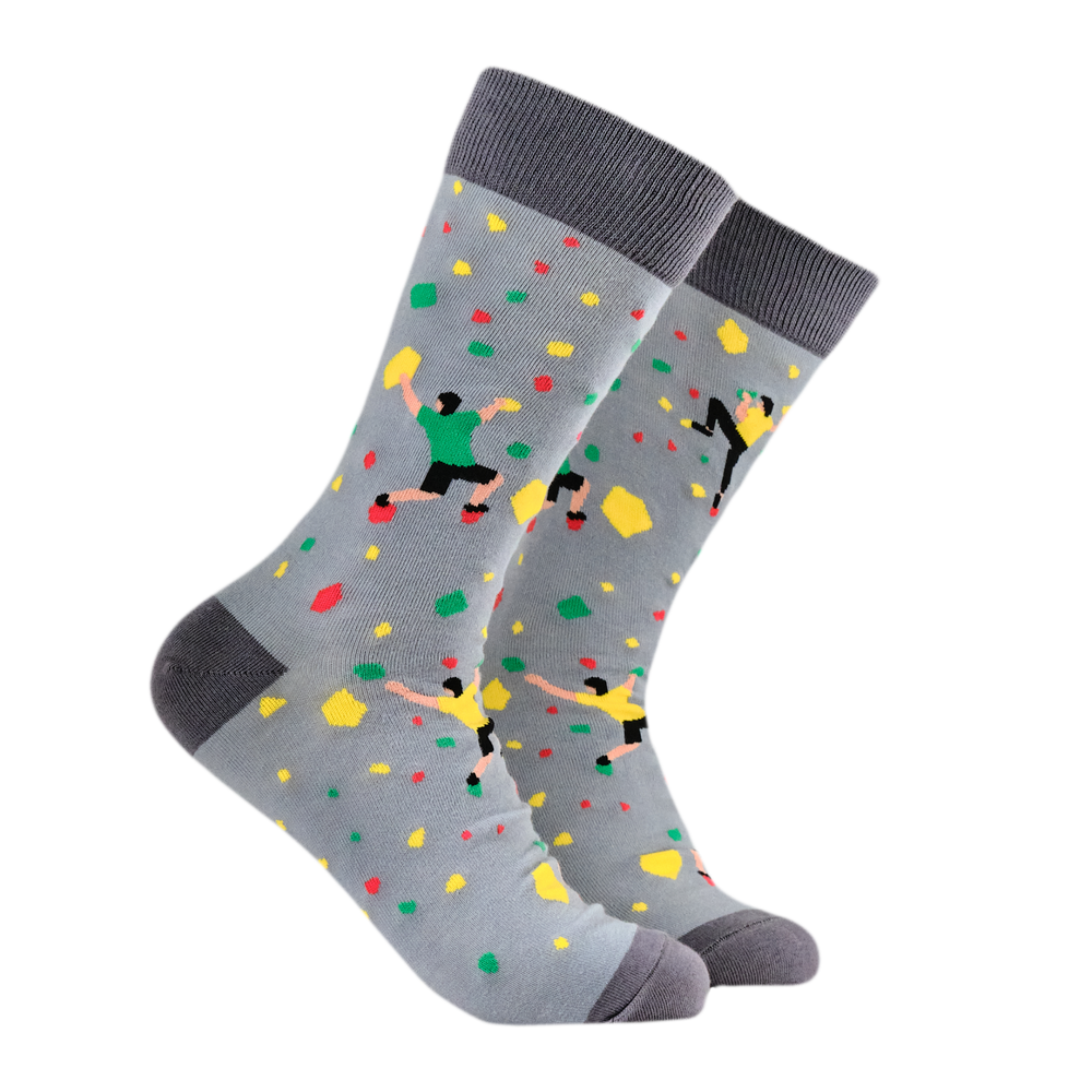 Rock Climbing Bamboo Socks. A pair of socks with a rock climbing motif. Grey legs, dark grey heel, toe and cuff. 