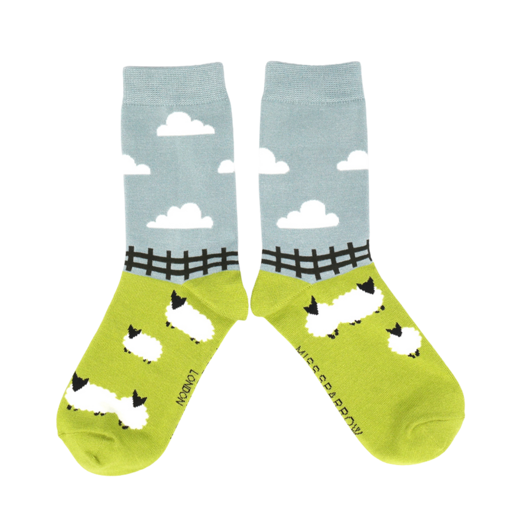 
                  
                    Sheep Meadows Bamboo Socks - Miss Sparrow. A pair of socks depicting sheep in a field. 
                  
                