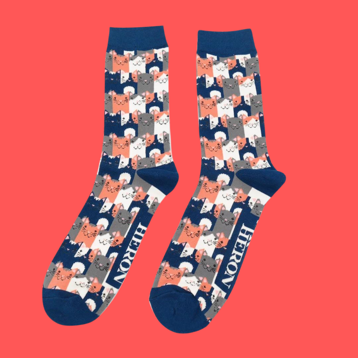 
                  
                    A pair of socks with a multicoloured happy anime cat pattern. Blue heel, toe and cuff.
                  
                